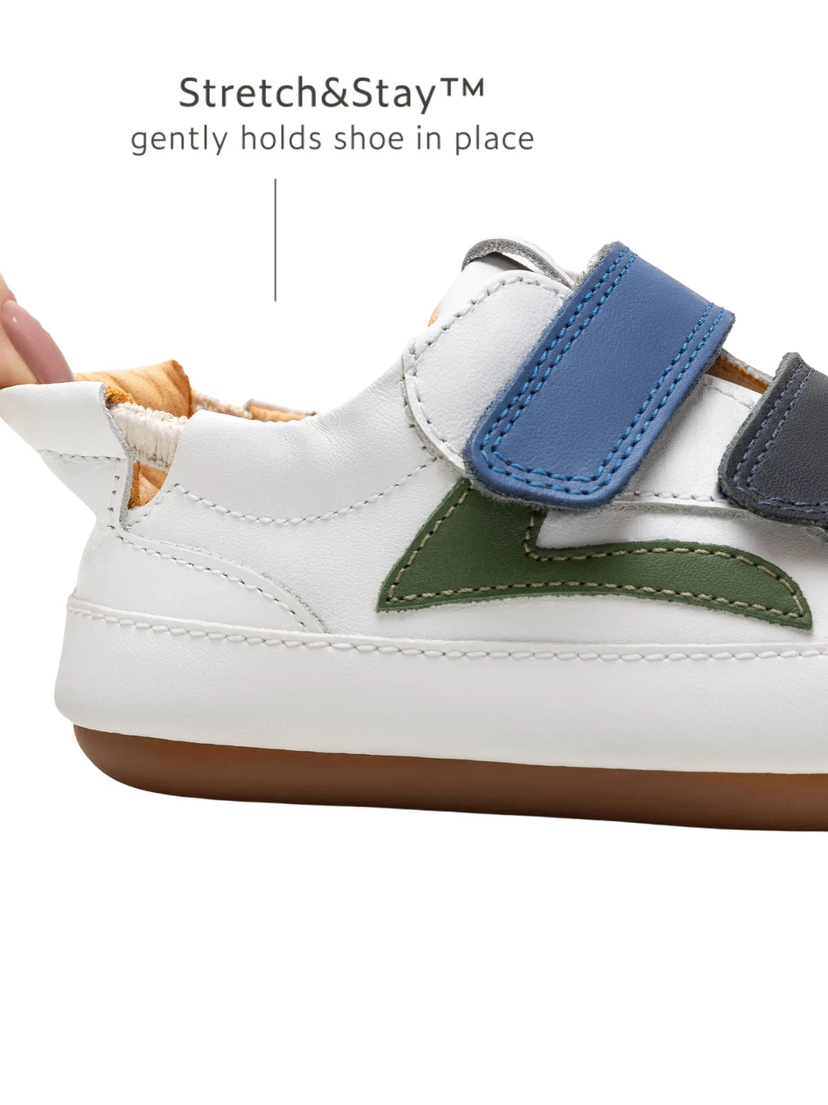 Close-up of the Stretch &amp; Stay elastic heel on the Landy baby sneaker, ensuring the shoe stays comfortably in place.