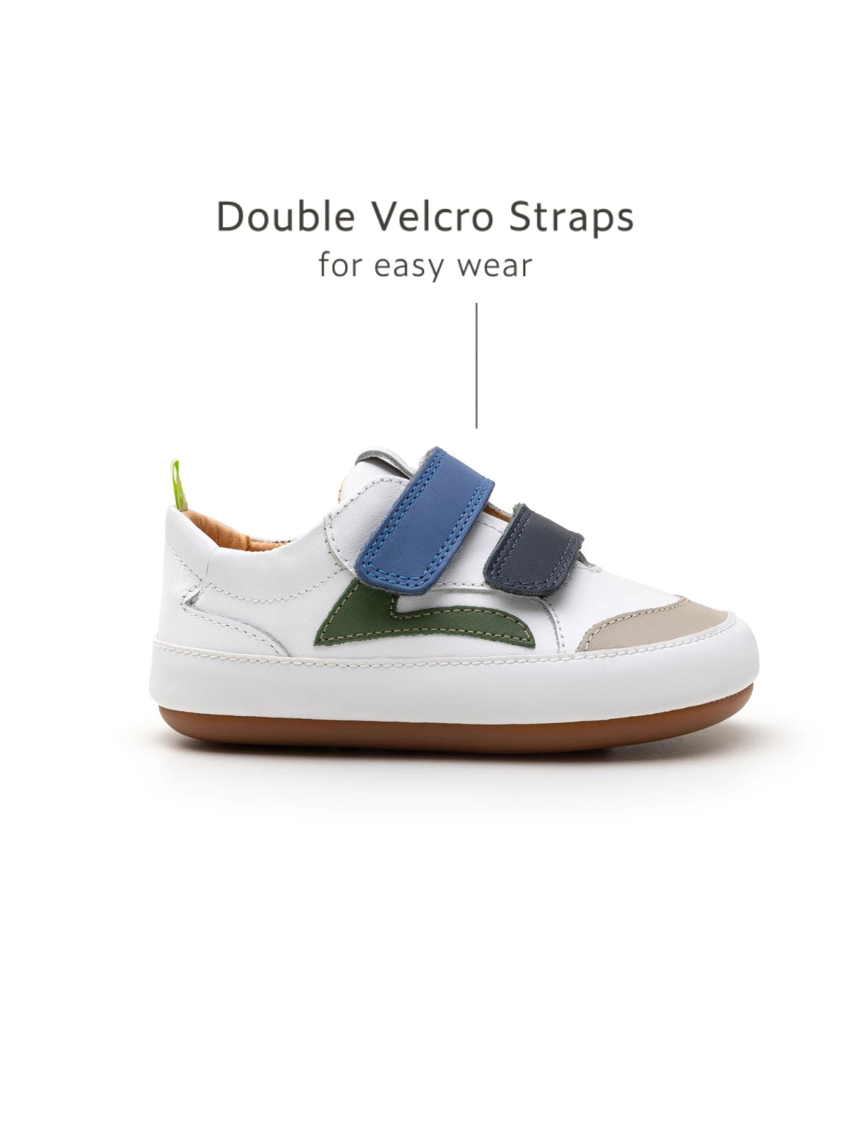 Side view of the Landy baby sneaker featuring double velcro straps for easy on-and-off and a secure infant fit.