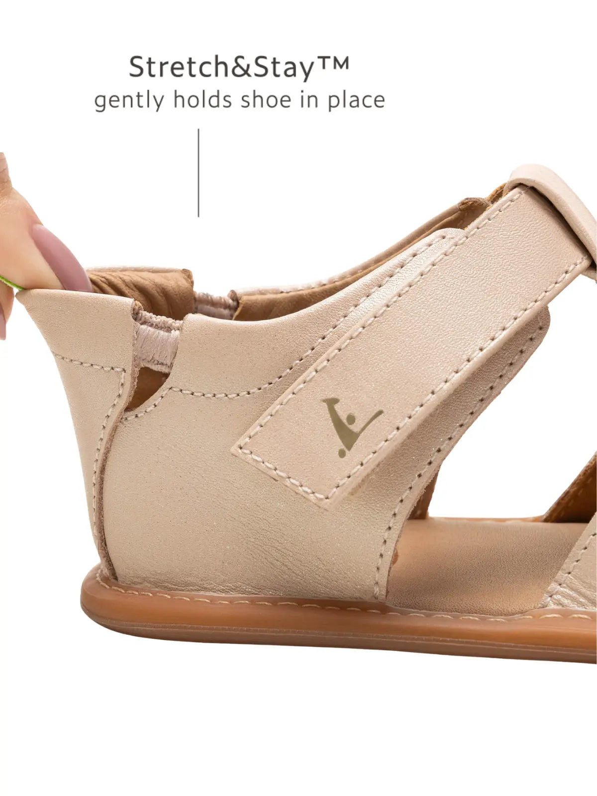 Close-up of the Stretch &amp; Stay elastic heel on the pink leather baby sandal for a secure, easy-on fit.