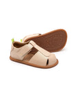 Soft candy dream pink leather baby sandals with a closed toe, adjustable strap, and flexible gum rubber sole.