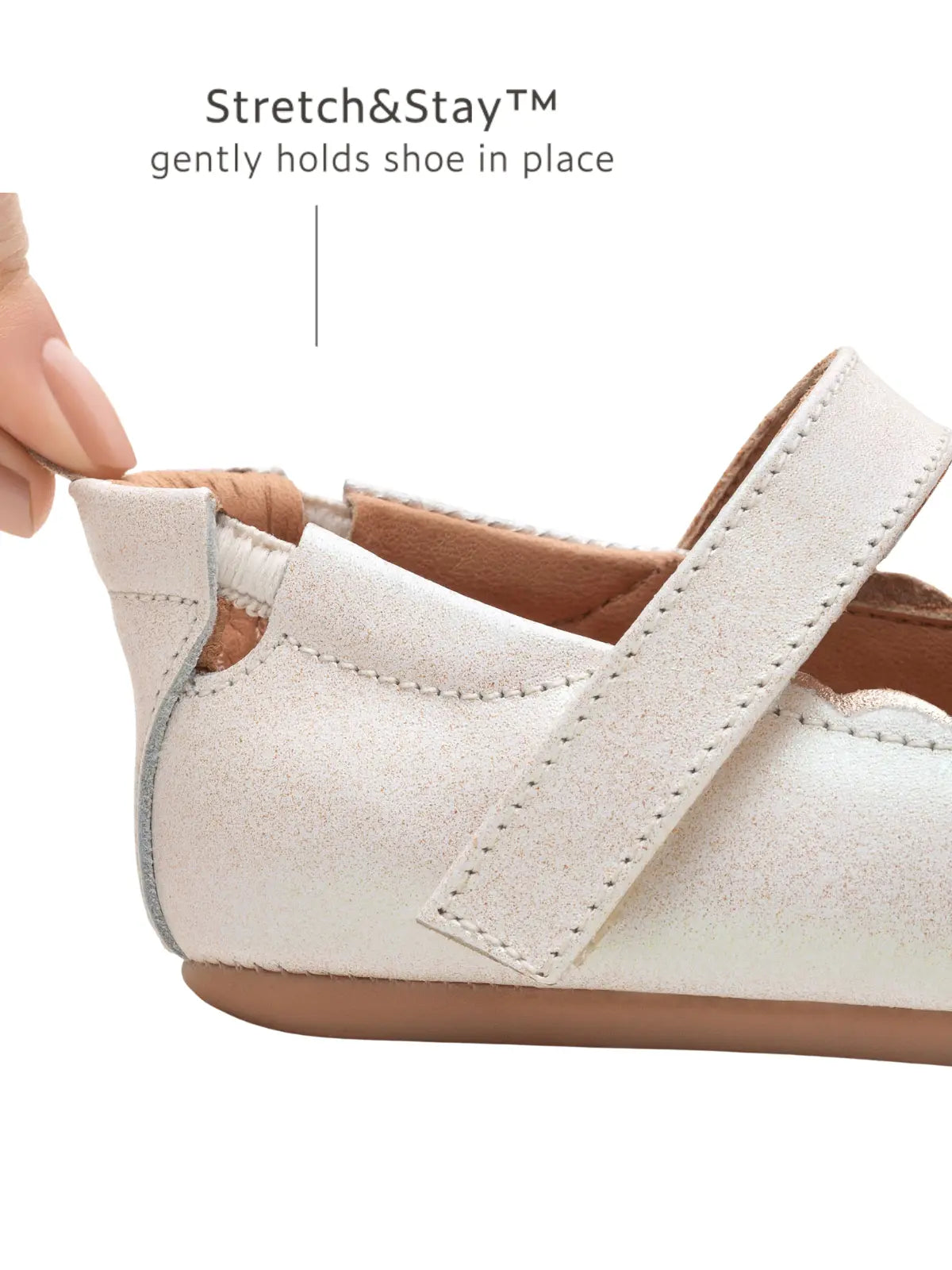 Close-up of the Stretch &amp; Stay elastic heel on the white dream baby shoe, ensuring it stays on tiny feet.
