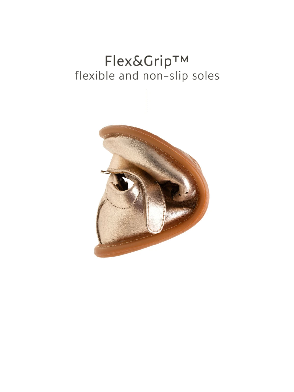 Showing the flexible Flex &amp; Grip sole on the metallic salmon baby shoe to support natural foot development.
