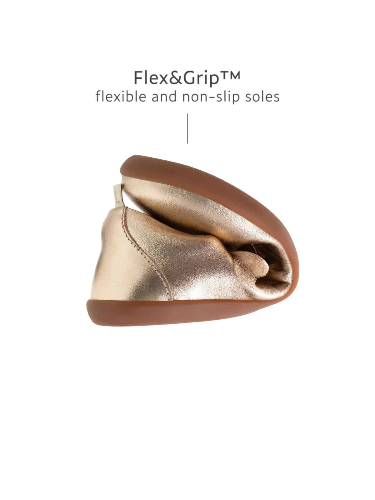 Demonstrating the flexible Flex &amp; Grip sole on the kids metallic salmon Mary Jane for natural movement.
