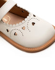 Close-up of the intricate heart-shaped laser cut-outs on the Tapioca leather baby shoe toe box.