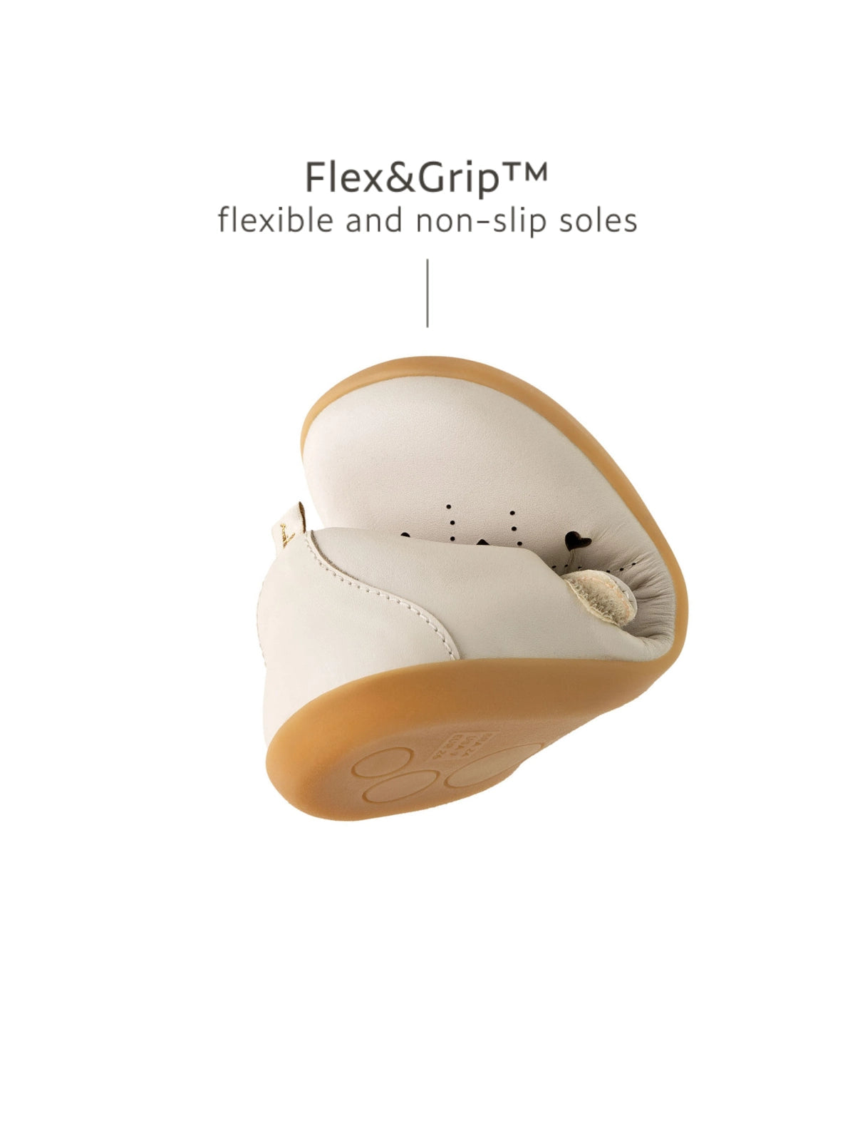 Demonstrating the flexible Flex &amp; Grip rubber sole on the metallic tapioca kids shoe for natural movement.