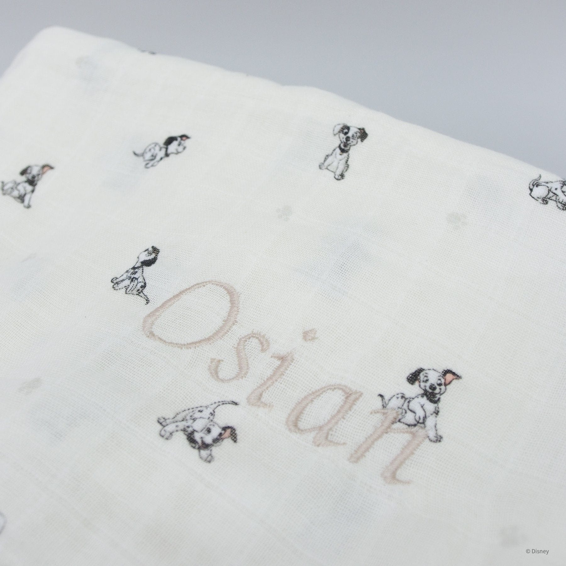 Beige Dalmatian puppy blanket with personalized name Osian